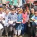 সাপ্তাহিক হাটে আসা পথচারীদের মাঝে দীপেন দেওয়ানের লিফলেট বিতরণ